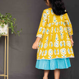 Mustard overcoat and blue lurex frock girls