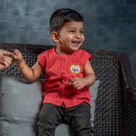 Smiling baby boy wearing cotton jabla with embroidery