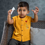 Smiling baby boy wearing cotton jabla with embroidery