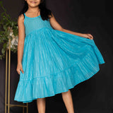 Mustard overcoat and blue lurex frock girls