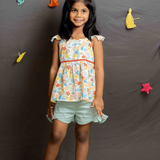 Floral top and green frill shorts