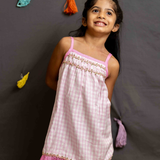 Pink gingham strappy frock with lace trim