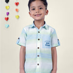 Boy wearing Blue Stripes shirt with Big Vibes written on It