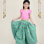 A girl wearing traditional attire in candy pink Cotton top and Green Block print skirt