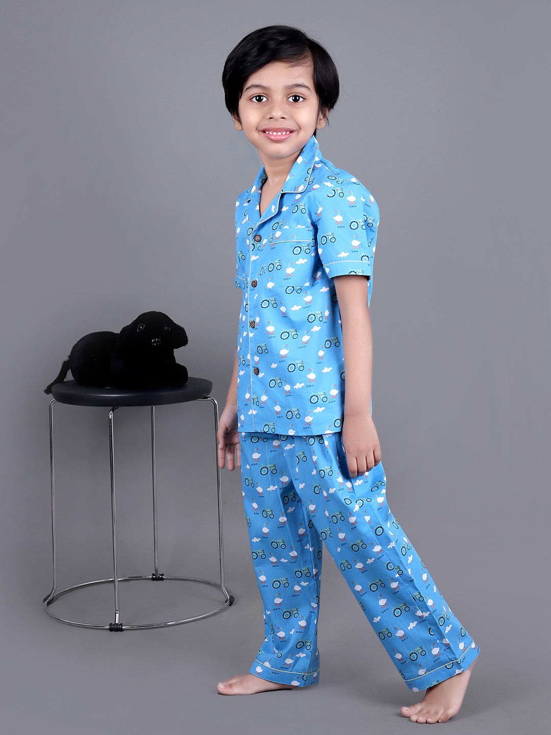 Boy wearing Blue Cotton night suit with ducks printed on it