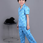 Boy wearing Blue Cotton night suit with ducks printed on it