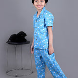 Boy wearing Blue Cotton night suit with ducks printed on it