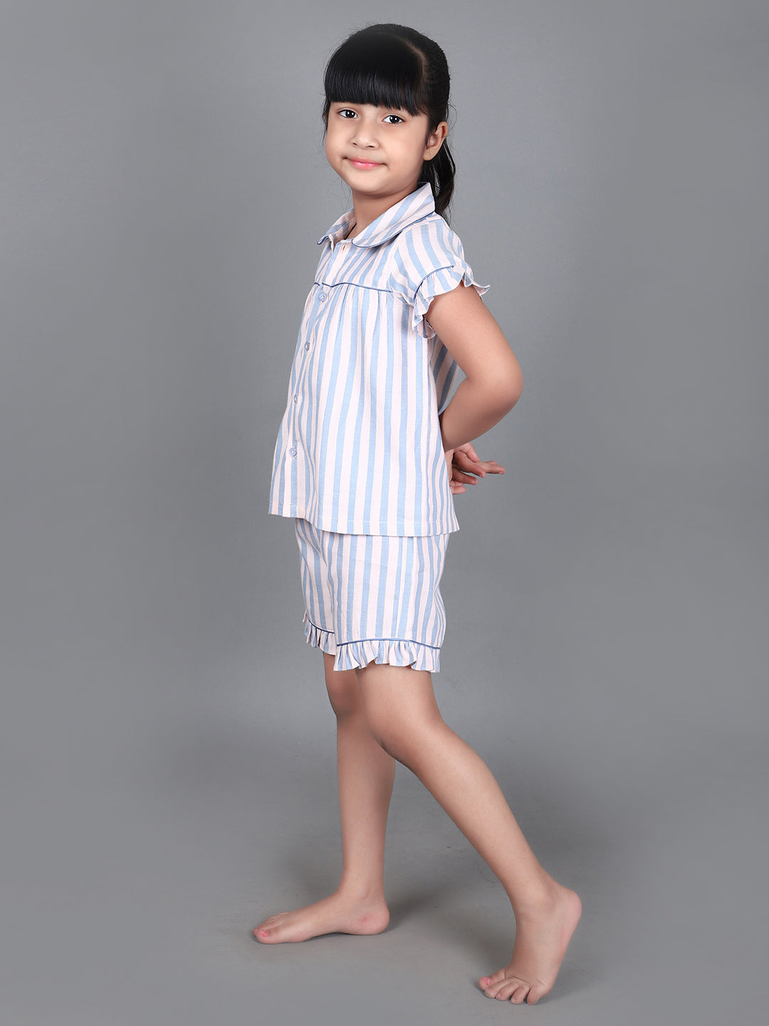 A girl wearing Blue striped cotton night dress with shorts
