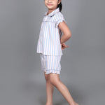 A girl wearing Blue striped cotton night dress with shorts