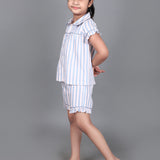 A girl wearing Blue striped cotton night dress with shorts