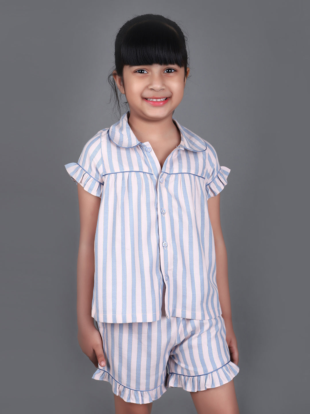 A girl wearing Blue striped cotton night dress with shorts