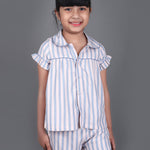 A girl wearing Blue striped cotton night dress with shorts