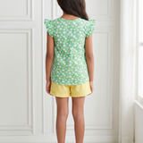 Green floral top and yellow shorts