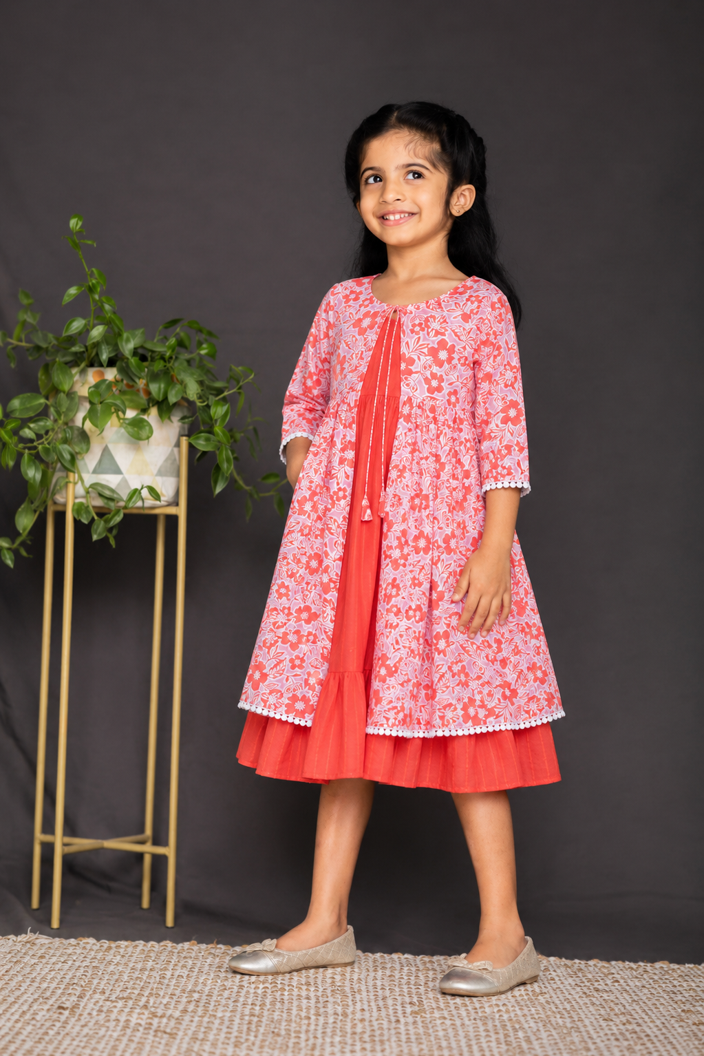 Orange strappy frock with floral overcoat