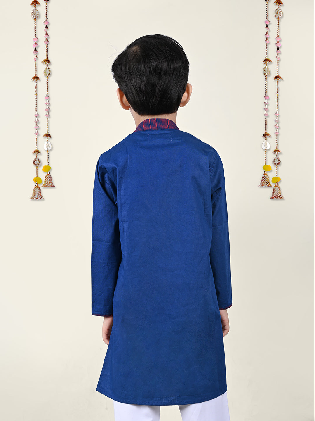 A boy Wearing Blue Asymmnetric Kurta